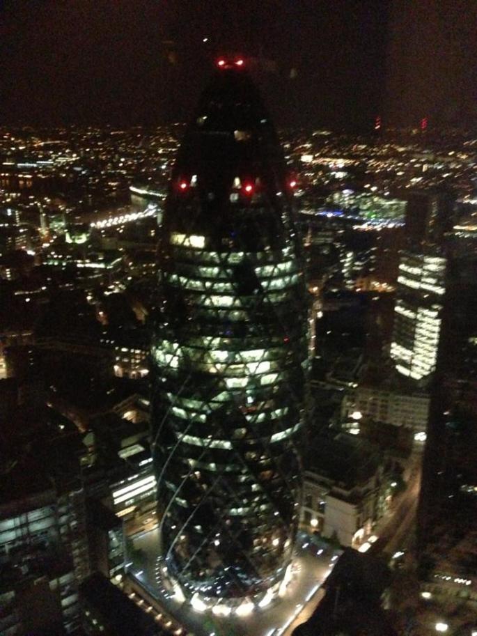 The Gherkin lit up at night
