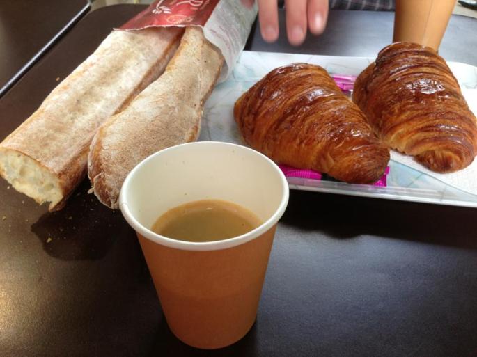 Enjoying Paris as you should. With coffee, bread, croissants, good friends and locals. 